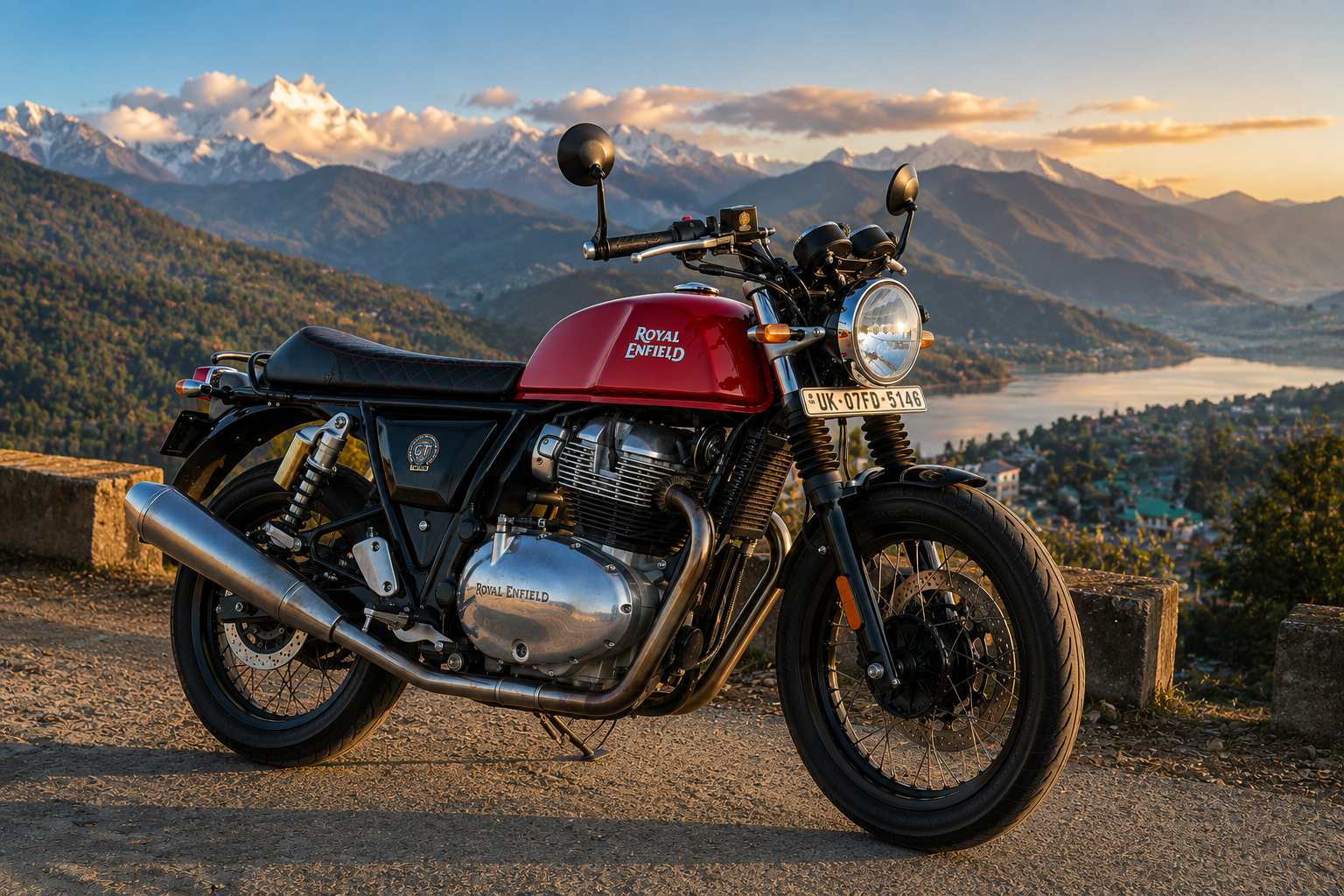Red Royal Enfield Continental GT 650 Red Rooster with a scenic mountain sunset backdrop.