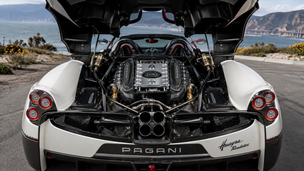 Pagani Huayra Roadster V12 engine bay with exposed carbon fiber and rear view of the supercar.