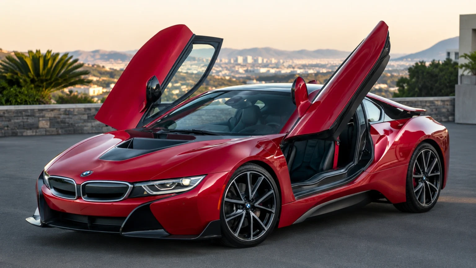 Red BMW i8 with butterfly doors open at a scenic city overlook.