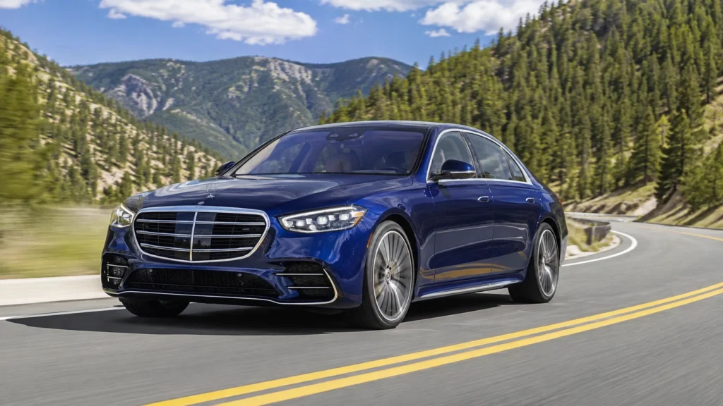 Blue Mercedes-Benz S-Class driving on a mountain road