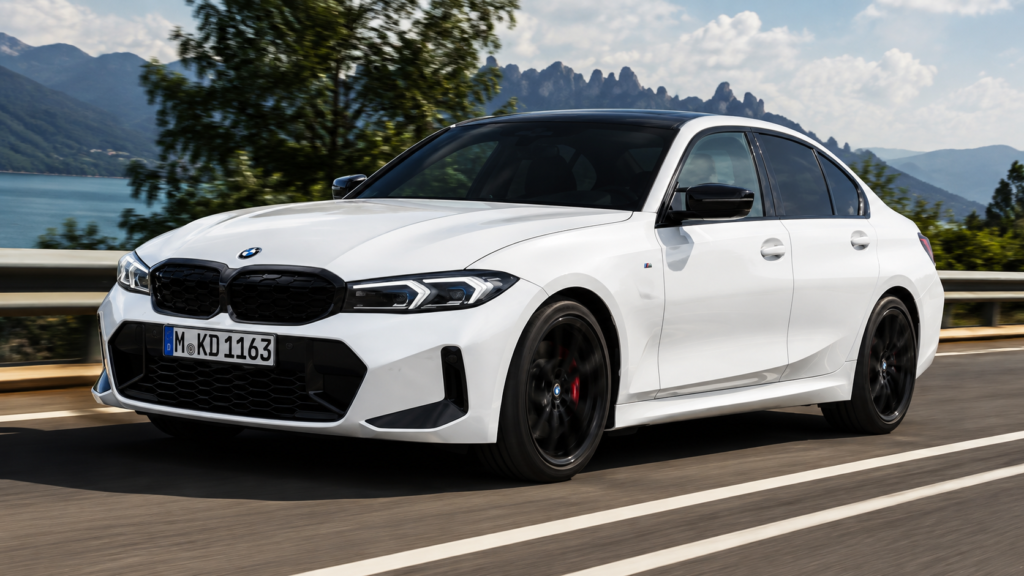 White BMW M340i driving on scenic mountain highway