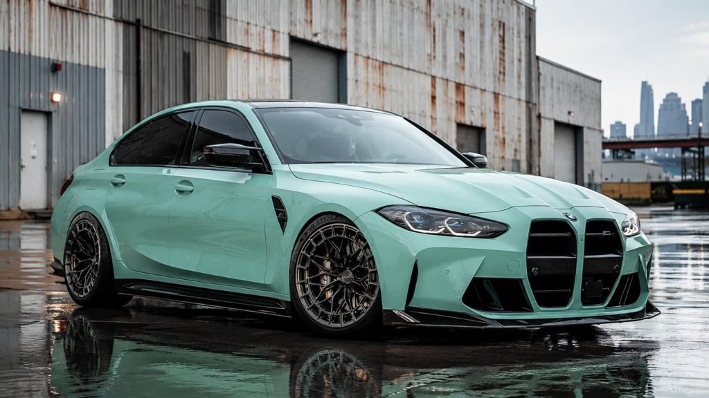 BMW M3 front three-quarter view in mint green